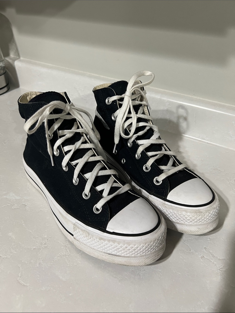 Black High-Top Converse All Star Sneakers with White Accents
